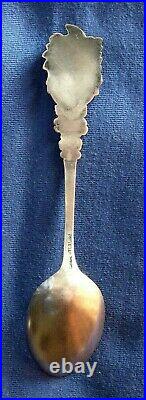 573-Antique sterling silver Indian head souvenir spoon