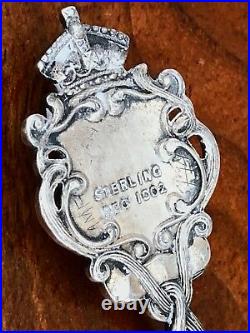 - Canadian Sterling Silver & Enamel Souvenir Tea Strainer Ornate Shell Pattern